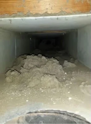 Supply trunk before cleaning, coated in dust