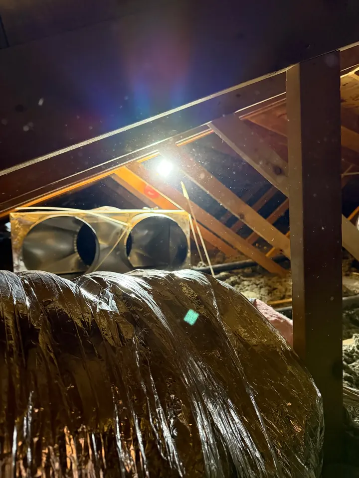 Insulated flex duct and duct collars in an attic