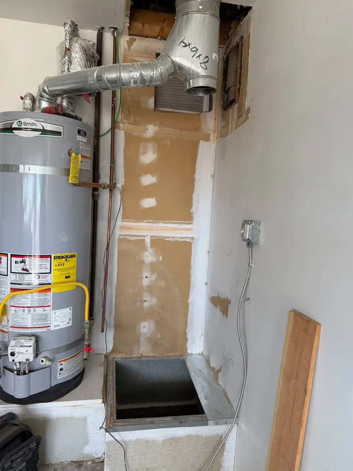 Water heater closet with the old platform opened up