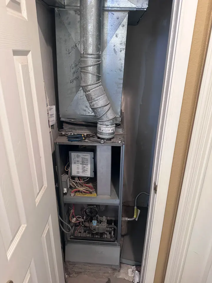 Furnace closet with the panel off during service