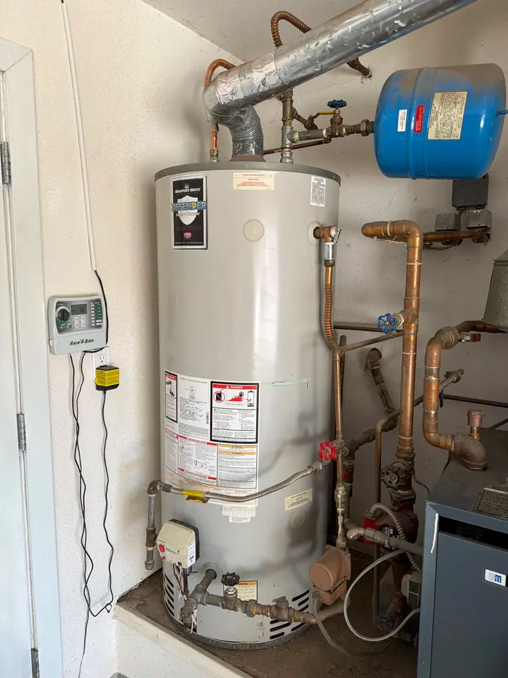 Water heater with an expansion tank and new piping