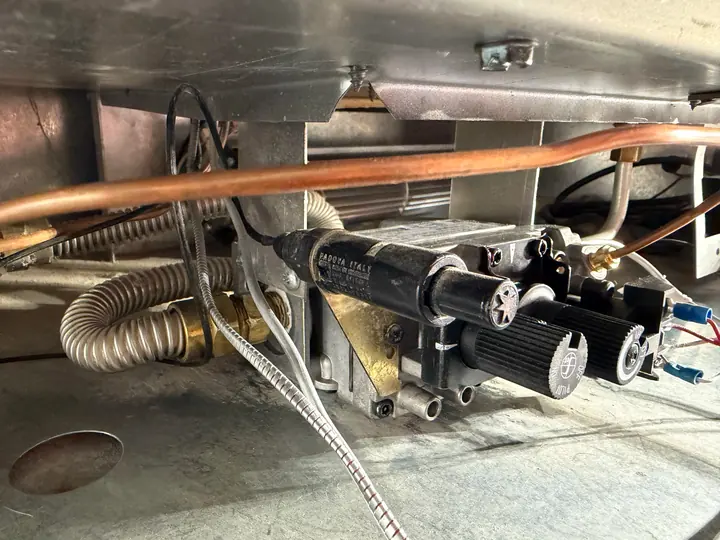 Gas valve and burner assembly under a unit