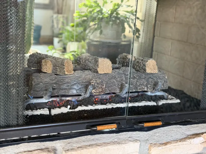 Gas fireplace lit behind glass