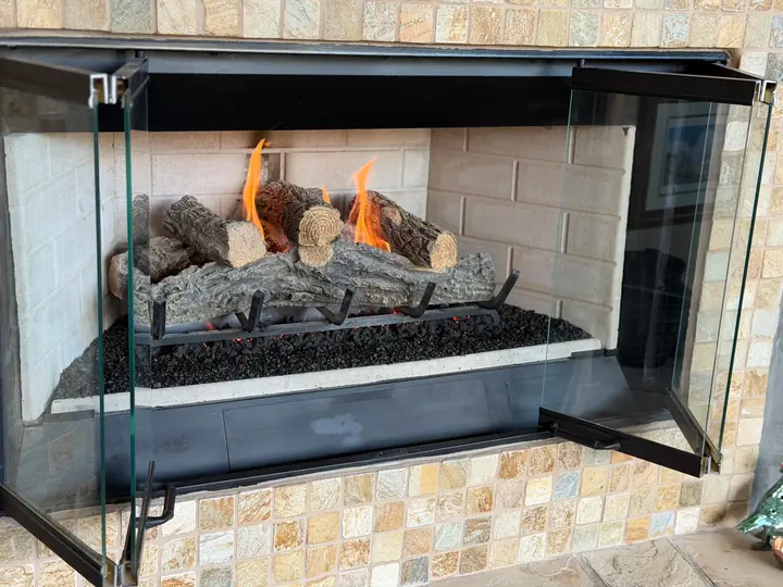 Gas fireplace burning in a tiled surround