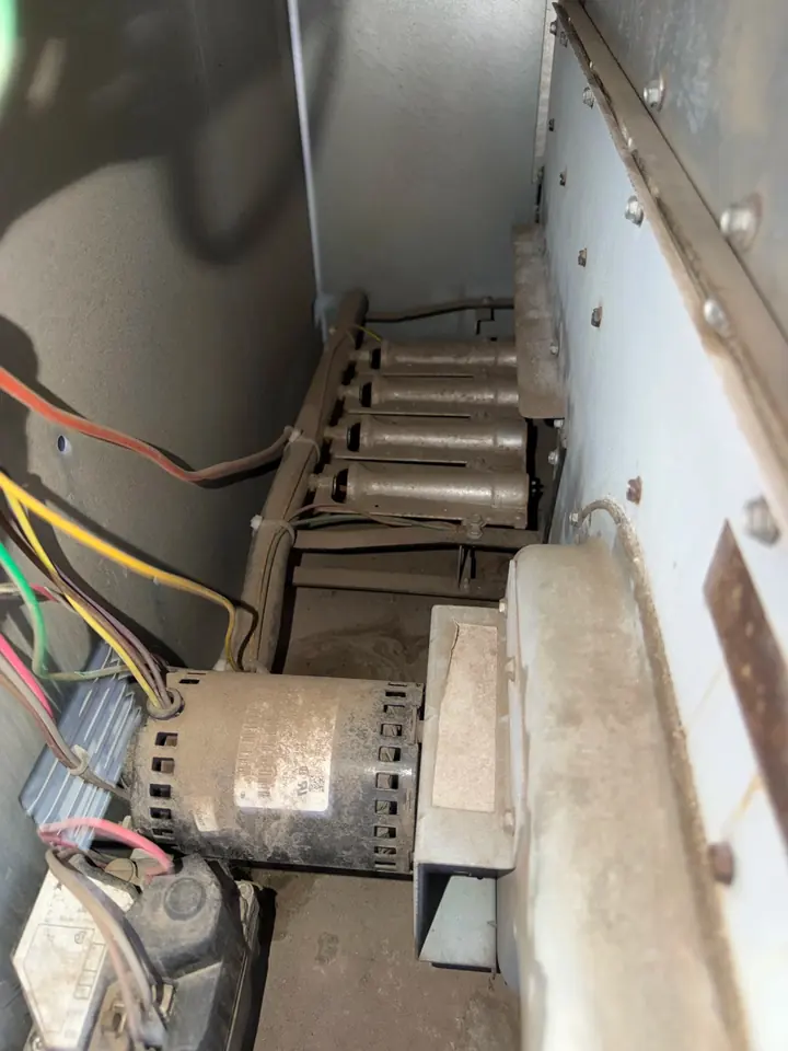Blower motor and belt inside an air handler