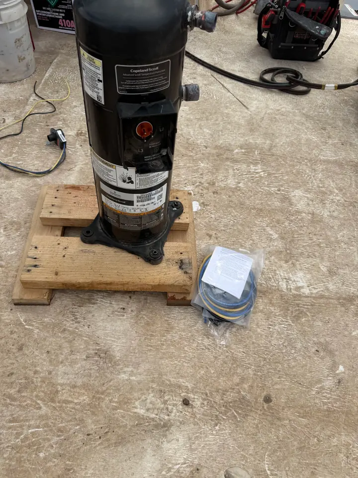 Replacement compressor on a pallet before install