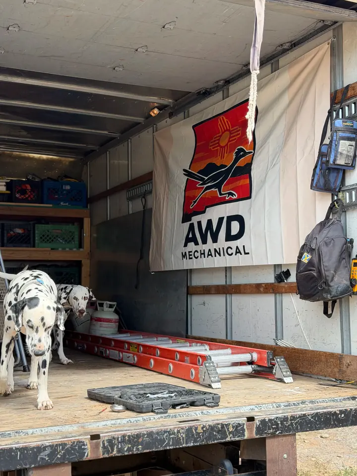 AWD Mechanical work truck loaded with gear and the shop dog