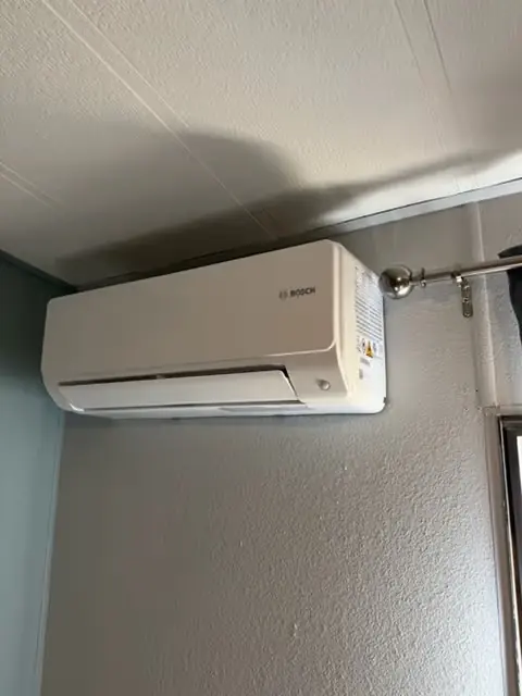 Mini split indoor head on a living room wall