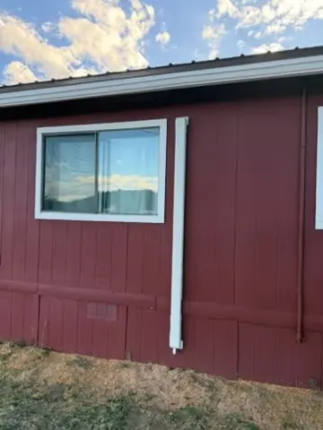 Finished line set cover beside a window