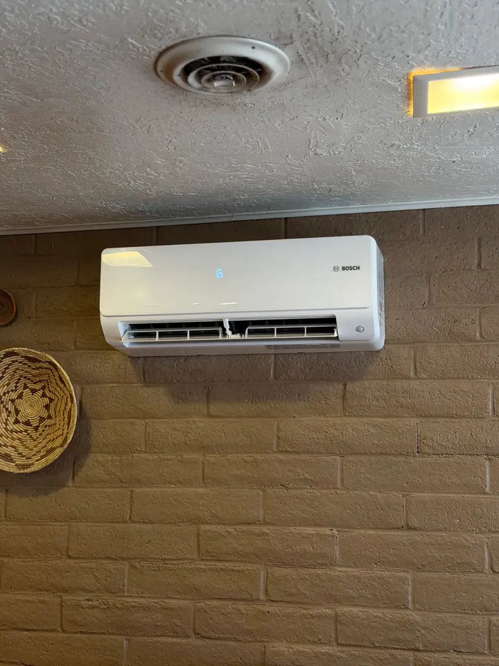 Mini split indoor head above a restaurant seating area