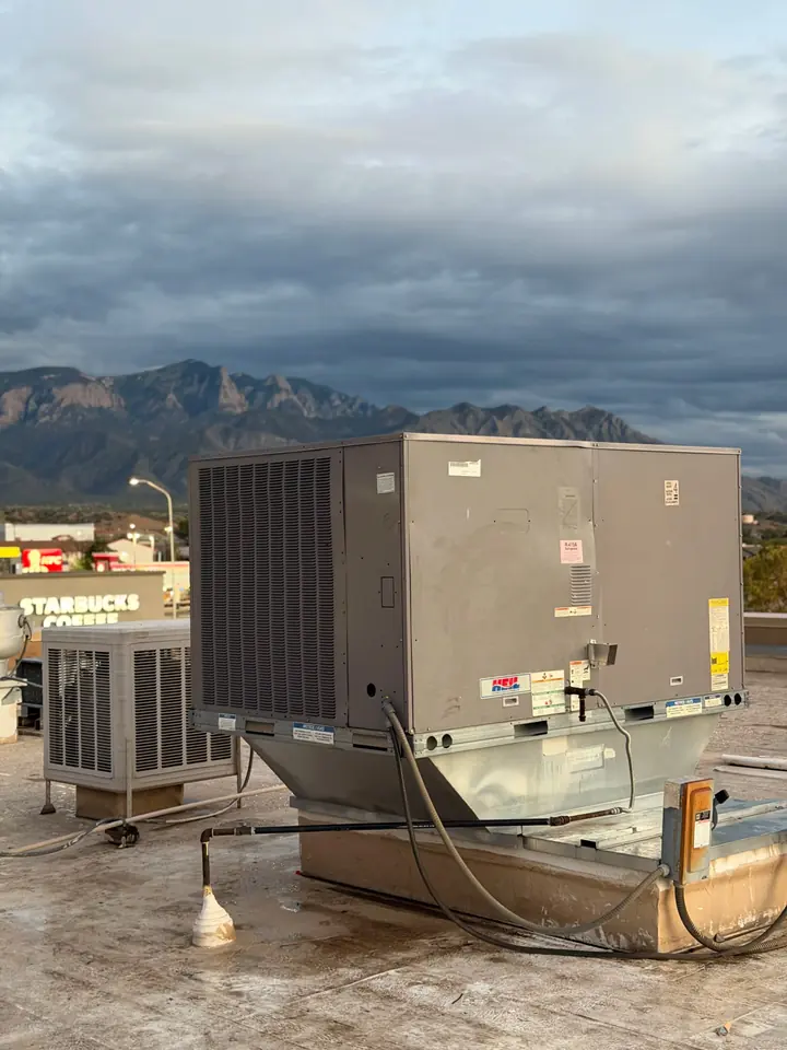 Commercial rooftop package unit with the mountains behind it