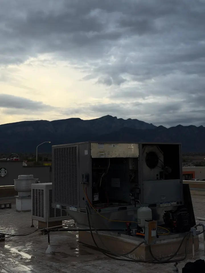 Rooftop unit at dusk under a cloudy sky