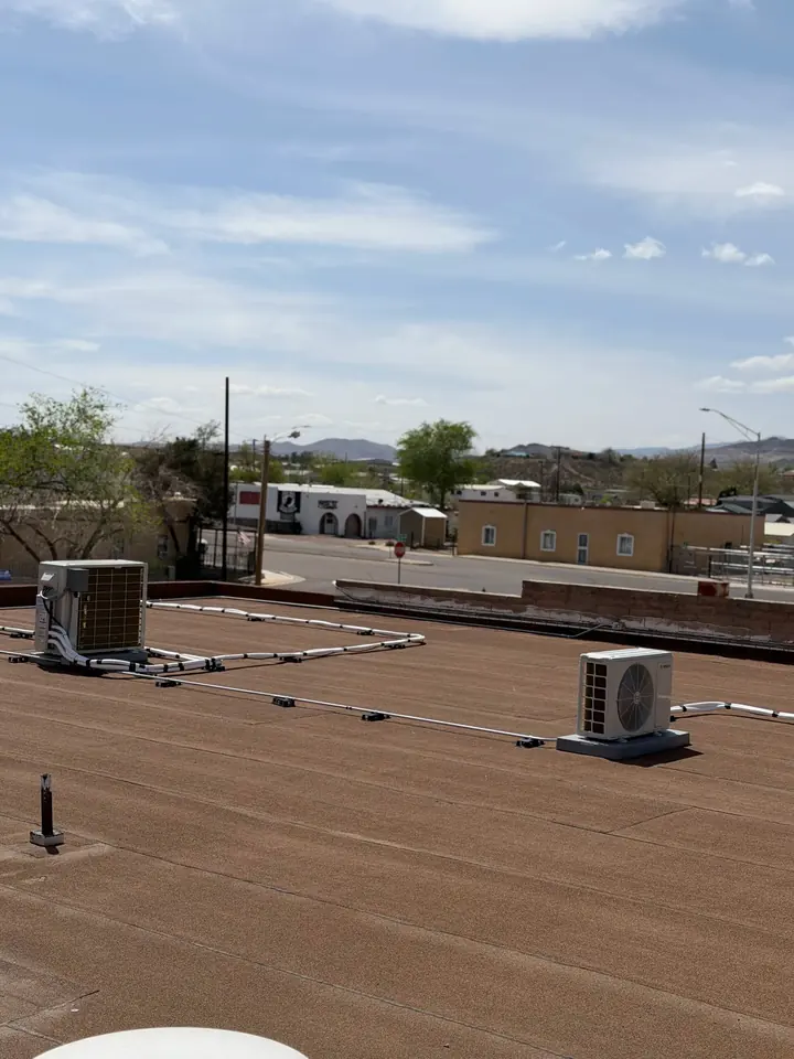 Rooftop units spread across a commercial roof