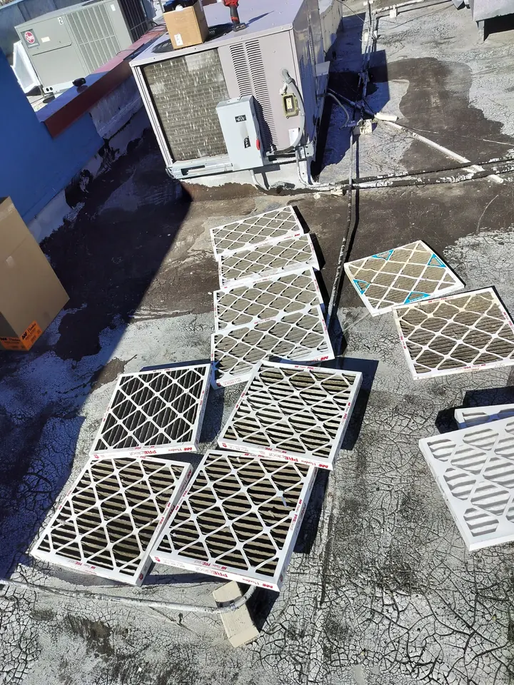 Replacement filters laid out on a commercial roof